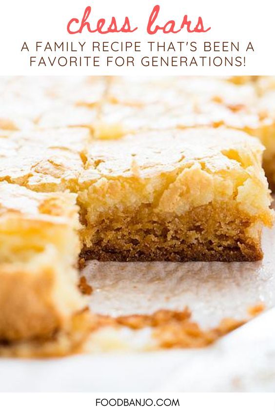 a close up of a piece of cake with the words cheese bars on top and below it