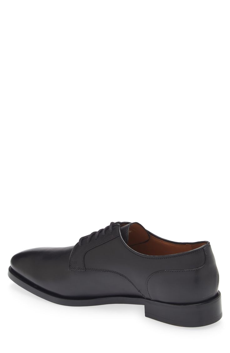 Clean lines and simple detailing bring easy versatility to a derby made of polished leather and styled to smarten any formal or semiformal look. Lace-up style Leather upper, lining and sole Made in the USA Fitted Business Derby Shoes With Plain Toe, Fitted Business Derby With Plain Toe, Timeless Fitted Derby For Business Casual, Business Fitted Plain Toe Derby, Fitted Timeless Derby For Business Casual, Fitted Business Derby Shoes, Classic Fitted Dress Shoes For Derby, Black Calf Leather Derby For Work, Timeless Black Derby Shoes For Semi-formal Occasions