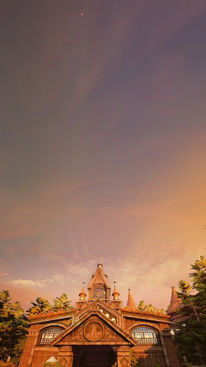 a large building with a clock on the top of it's roof and windows