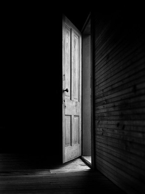 an open door in a dark room