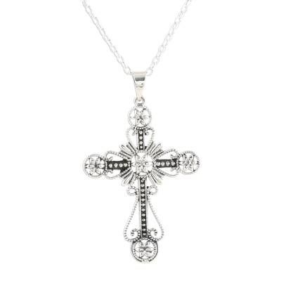 Decorated with flowers and looping designs a majestic cross is crafted from sterling silver accentuated by a combination between high-polish and oxidized finishes. India's Shivany Choudhary designs this faithful pendant necklace. Elegant Nickel-free Cross Pendant Necklace, Ornate Sterling Silver Cross Jewelry, Elegant Cross Pendant Necklace With Oxidized Finish, Elegant Oxidized Cross Pendant Necklace, Elegant Nickel Free Crucifix Necklace, Ornate Silver Cross Jewelry, Antique Silver Spiritual Cross Pendant Jewelry, Ornate Silver Cross Pendant Necklace, Antique Silver Cross Necklace Spiritual Style