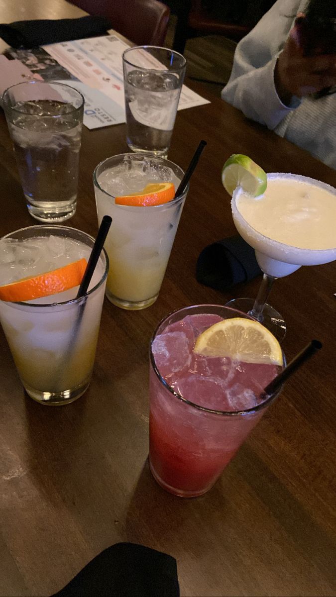 several different types of drinks on a table