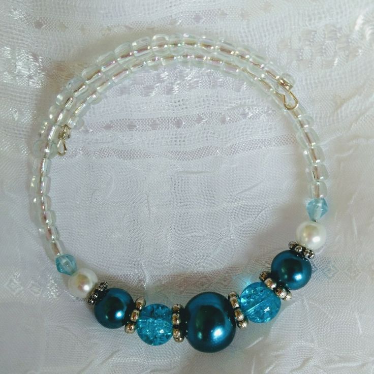 a blue and white beaded bracelet with pearls