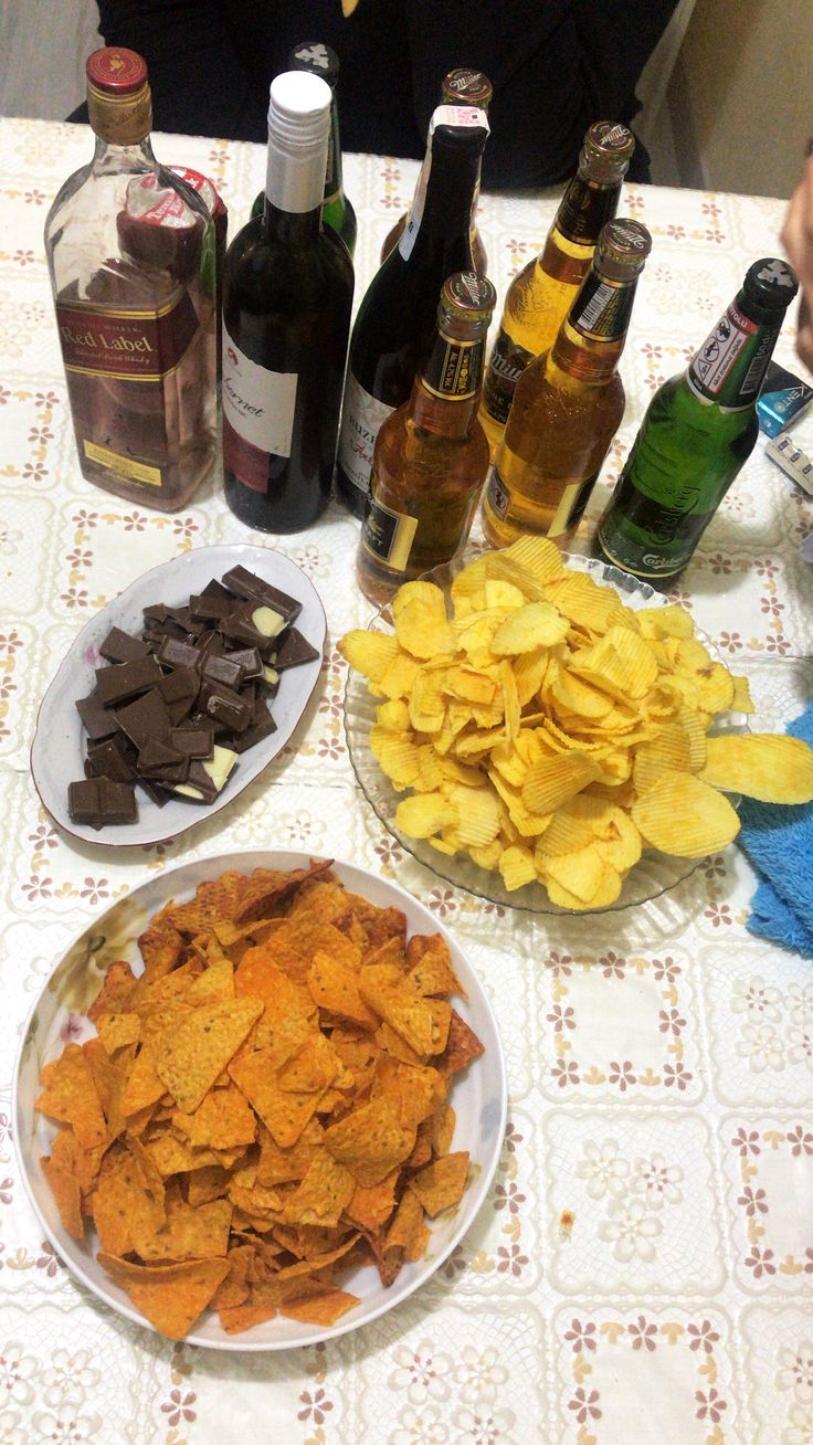 the table is covered with chips and bottles