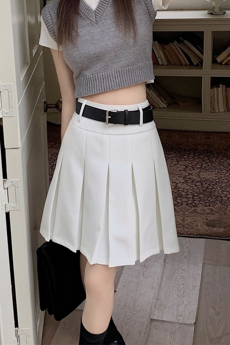 preppy pleated skirt, white knee-length pleated skirt, school outfit ideas boogzel clothing Classic Mini Pleated Skirt For Work, Pleated High Waist Mini Skirt For School, High Waist Pleated Mini Skirt For School, Spring Office Wear Pleated Skort, Pleated Skort For Office In Spring, School Uniform Style Pleated Mini Skirt, Workwear Pleated Mini Skirt, Fitted Knee-length Pleated Skort, Preppy High Waist Pleated Mini Skirt