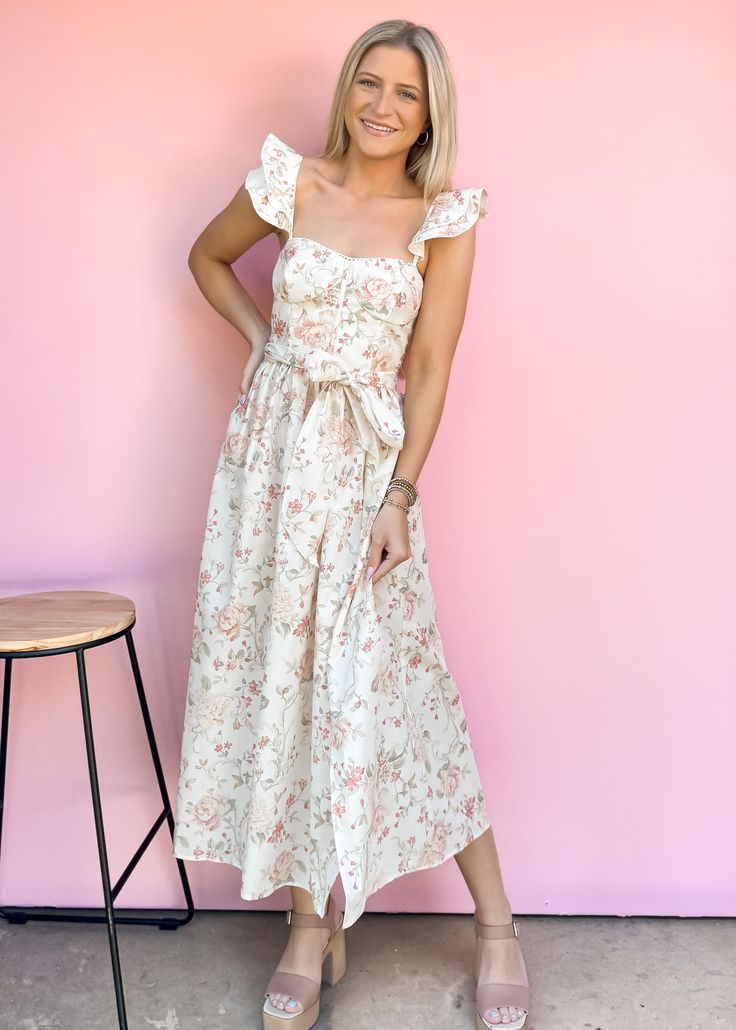 This is THE summer event midi. The lightweight fabric has a floral design and the cutest boned bodice. A smocked back detail and adjustable spaghetti straps on the back create a customizable fit. Style with nude heels for your next summer event, bridal shower, or date night. True to size Model is wearing small Size up if between sizes Color: White background with multicolor print Printed woven midi dress Adjustable straps Smocked back bodice Fabric has no stretch Not lined Boned Bodice, Floral Dress Casual, Black Short Dress, Summer Events, Vacation Dresses, Nude Heels, Dress With Cardigan, Dressy Casual, Floral Dress Black