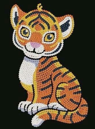 a beaded tiger sitting on top of a black surface with orange and white stripes