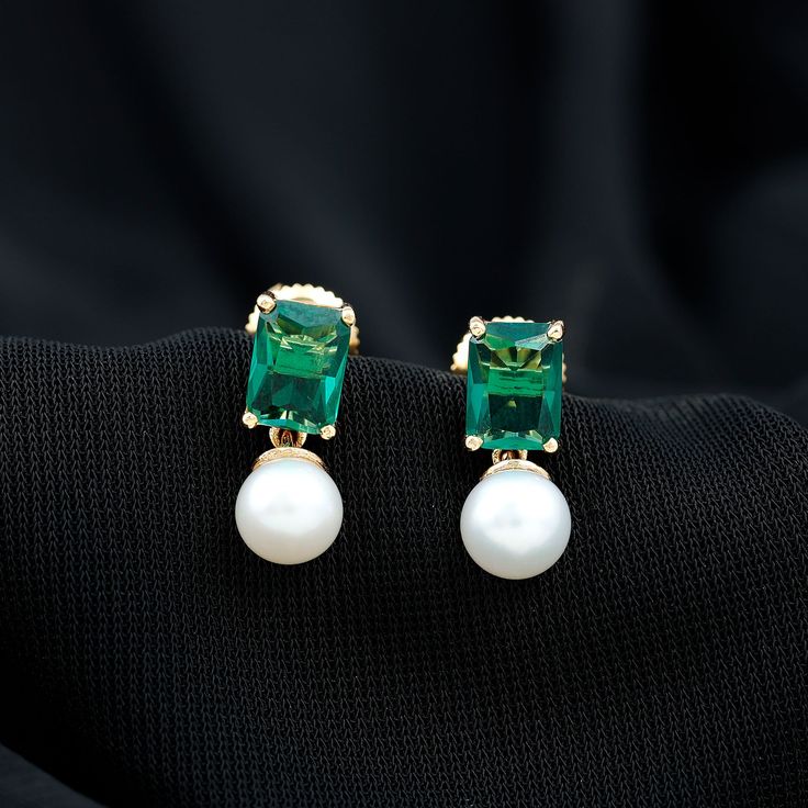 Product Details Make a statement with these stunning Octagon Cut Created Emerald earrings, set in a Prong Setting and paired with elegant Freshwater Pearl Drops. Crafted from high-quality gold, these Pearl earrings are a perfect blend of classic elegance and modern design, making them an ideal accessory for any occasion. Product Information SKU SHP-EARRINGS082210232 Weight 1.15 gm (Approximate) FRESHWATER PEARL INFORMATION No.of Stones 2 Pieces Total Weight 4.47 Carat (Approximate) Dimension(app Pearl Emerald Earrings, Freshwater Pearl Drop Earrings, Lab Created Emerald, Emerald Earrings, Pearl Drop Earrings, Pearl Drop, Classic Elegance, Earrings Set, Emerald Cut