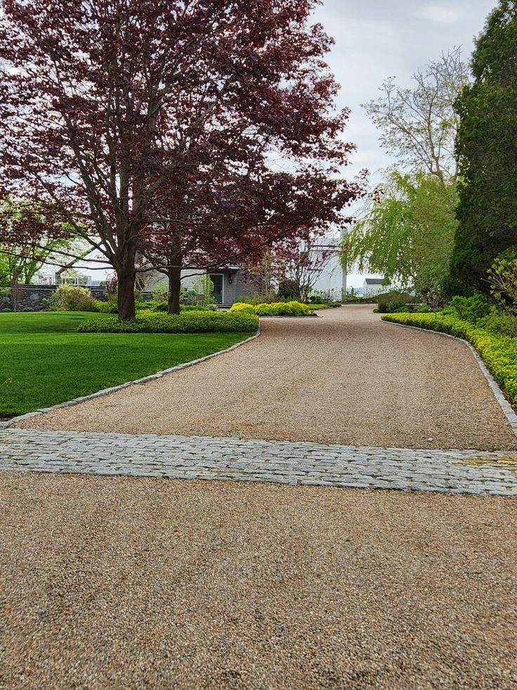 an empty pathway in the middle of a park