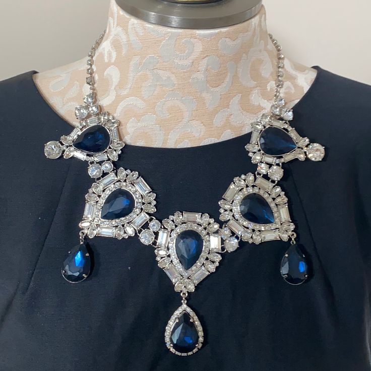 New With Tag! Simply Stunning Statement Necklace! Silver Tone With Deep Blue & Clear Rhinestone Accents. The Center Piece Including Dangle Is Approx 3.5” Long Chain Has 3” Extender To Adjust Length Of Necklace Blue Jeweled Necklace For Party, Party Sapphire Necklace With Sparkling Stones, Sapphire Necklaces With Jewels For Party, Blue Jeweled Necklaces For Party, Blue Stone Necklace For Formal Occasions, Blue Necklaces With Sparkling Stones For Party, Blue Jewel Necklaces For Parties, Formal Blue Necklace With Stones, Party Blue Necklaces With Sparkling Stones