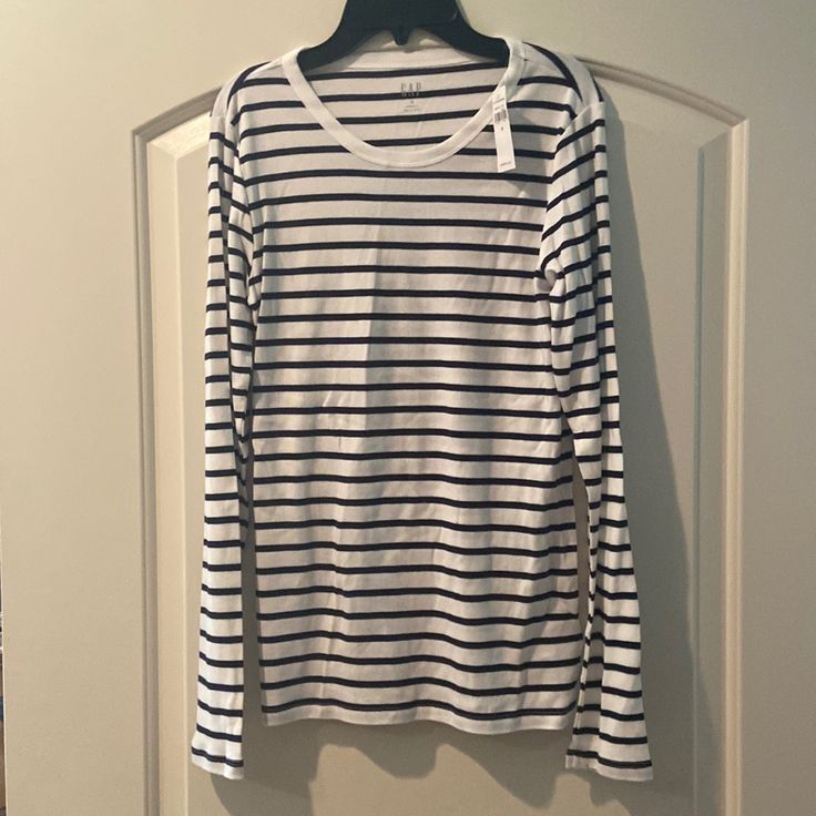 Womens Gap Long Sleeve Navy/White Striped Shirt (Size Medium). Brand New With Tags. Never Worn. Smoke Free Home. Classic Gap Tops For Everyday, Classic Everyday Gap Tops, Classic Everyday Tops From Gap, Classic Gap Tops For Spring, Casual Striped Tops By Gap, Casual Striped Tops From Gap, Casual Striped Gap Tops, White Gap Shirt For Spring, Spring Striped Gap Tops