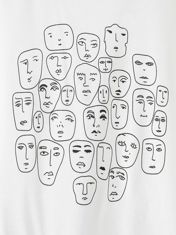 a white t - shirt with many faces drawn on it