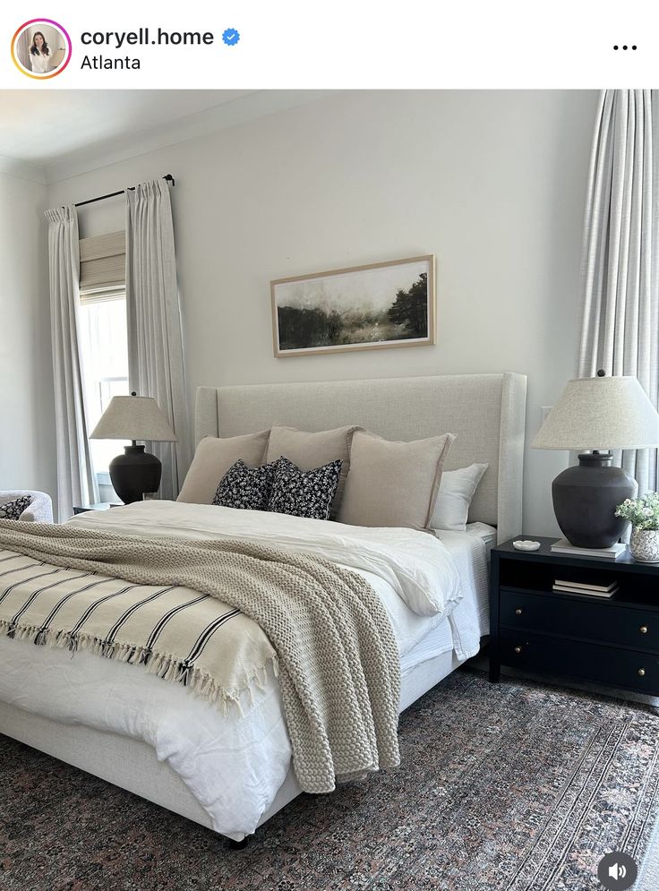 a large bed sitting in a bedroom on top of a rug