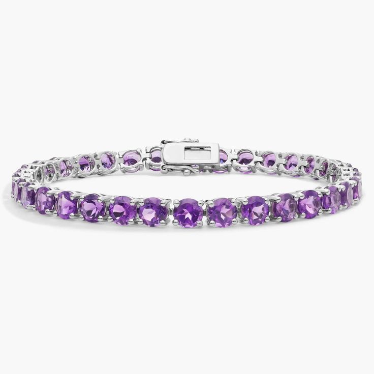 Brightly hued, this amethyst bracelet is crafted in sterling silver and features thirty-four round amethyst gemstones in a flexible single line design. Classic Amethyst Bracelets, Elegant Purple Rondelle Bracelets, Luxury Round Amethyst Bracelets, Elegant Silver Tennis Bracelet With Amethyst, Elegant Silver Amethyst Tennis Bracelet, Elegant Silver Tennis Bracelet, Luxury Purple Tennis Bracelet, Classic Amethyst Bracelets In Purple, Elegant Sterling Silver Amethyst Gemstone Bracelet