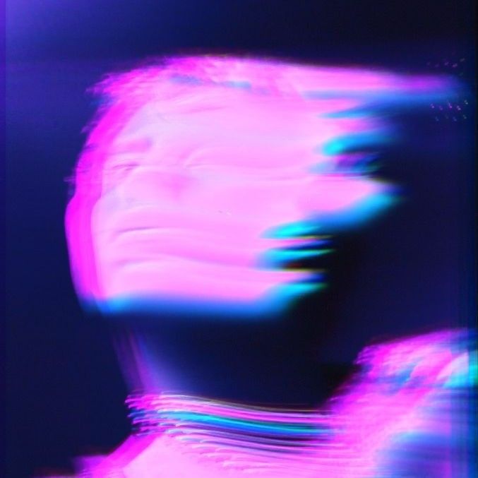 a blurry image of a woman's face and neck