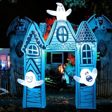 a house decorated for halloween with ghost decorations