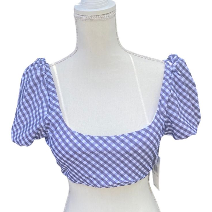 Brand: Raisins Department: Women's Size: L Condition: New With Tag Item: Swimsuit Top Style Name: Paris Top Pattern: Gingham Color: Blue And White Lined: Yes (White) Sleeve: Puffed Material: Made With Recycled Fibers Detail: Elastic Is Band, Shoulder, Arm And Neck Cups: Padded - Pads Not Removable Closure: Low Back With Tie Material: 84% Recycled Polyester 16% Spandex Care: Hand Wash Item Ships, Videoed, And Photographed With A 360 Security Tag In Place With Serial Number And Tamper-Evident Seal Blue Summer Top For Picnic, Blue Summer Tops For Picnic, Fitted Summer Crop Top For Picnic, Summer Fitted Crop Top For Picnic, Cute Blue Crop Top For Summer, Blue Fitted Top For Picnic, Fitted Crop Top For Summer Picnic, Fitted Blue Top For Picnic, Fitted Blue Tops For Picnic