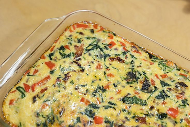 a casserole dish with vegetables in it on a table