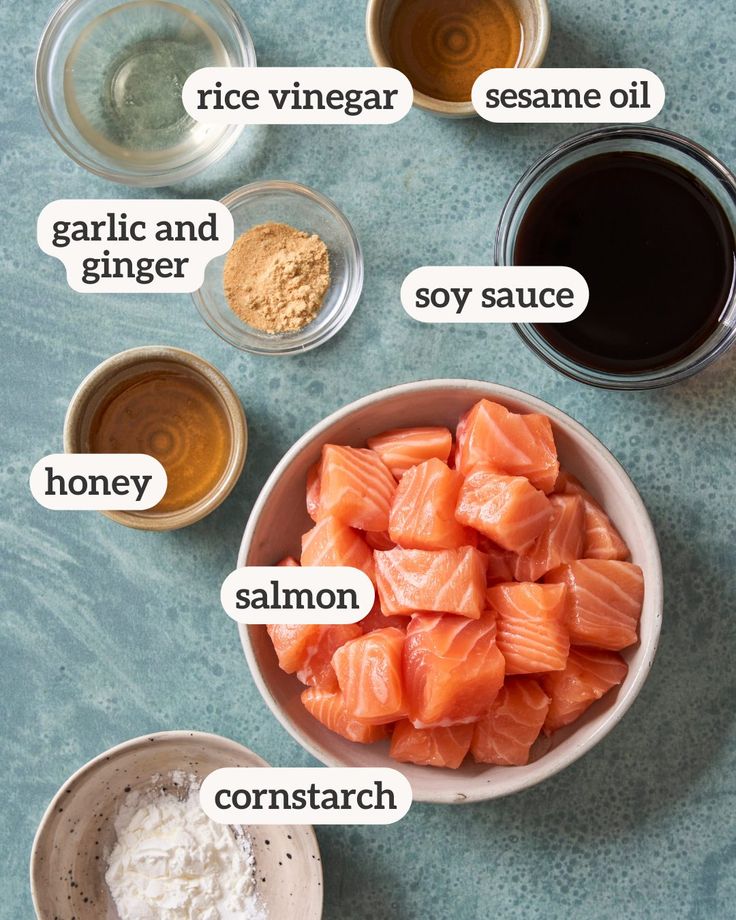 the ingredients to make salmon sauce in bowls on a blue counter top with text overlay