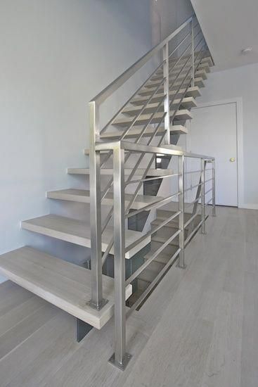 the stairs are made of metal and wood