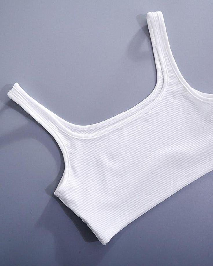 Details: Essential ribbed braletTop Length: CroppedSleeve Length: SleevelessMaterials:95% Polyester + 5% Spandex Ribbed Cropped Sports Bra, White Seamless Cropped Top, Micro-elastic Seamless Athleisure Crop Top, White Ribbed Racerback Crop Top, White Stretch Crop Top, Bra Friendly, Bralet Tops, Spandex