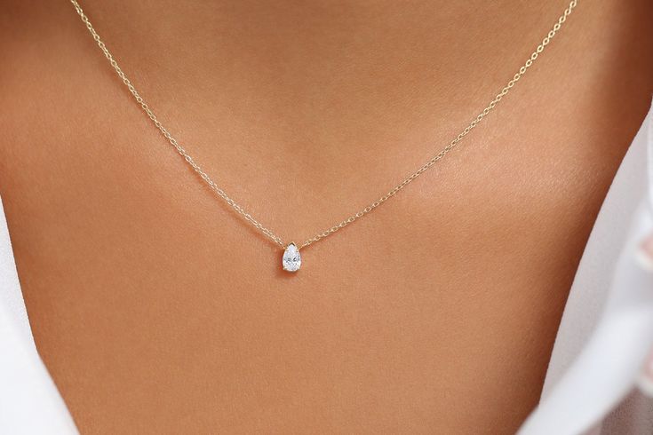 "Pear Shaped Diamond Necklace/ 14K Gold Pear Shape Diamond Choker Necklace/ Pear Shape Diamond Necklace / Black Friday Item Details * Made to Order. * Gold Kt: 14K (Please message me if you want 18K) * Custom Gold Color: Rose Gold, Yellow Gold, White Gold * Pear Shape Diamond: 1 pc 5.5 x 3.5MM * Total Number of Stones: 1 * Total CTW: 0.23 Ctw * Diamond Color-Clarity: G Color Si Clarity * Setting Type: Prong * Ready to Ship in 7-10 Business Days If you have any additional questions about this pro Yellow Gold Drop Necklace For Anniversary, Timeless Pear-shaped Anniversary Necklace, Timeless Pear-shaped Wedding Necklace, Formal Yellow Gold Pear-shaped Diamond Necklace, Formal Pear-shaped Yellow Gold Diamond Necklace, Fine Jewelry Pear-shaped Necklace With Brilliant Cut, Wedding Necklace With Prong Setting And Pear Shape, White Gold Necklace With Single Pear-shaped Diamond, Fine Jewelry Pear-shaped Necklaces For Anniversary