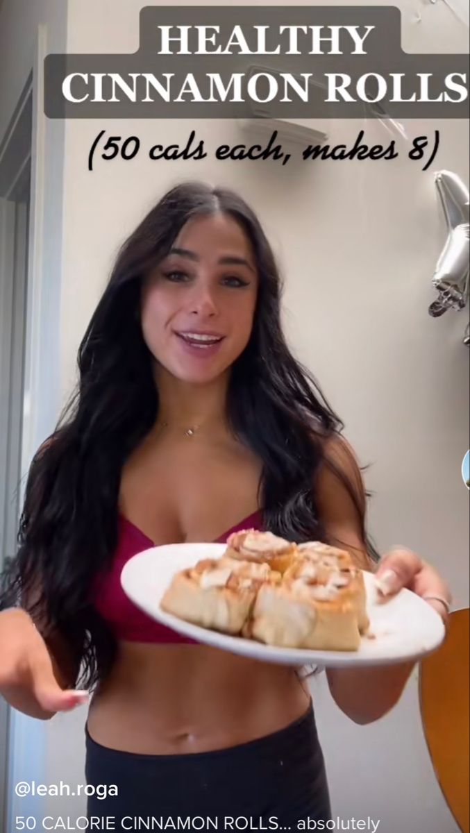 a woman holding a plate with food on it and the caption reads healthy cinnamon rolls 350 cals each, makes 8