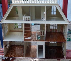 a doll house is shown with all the furniture in it's own room and stairs