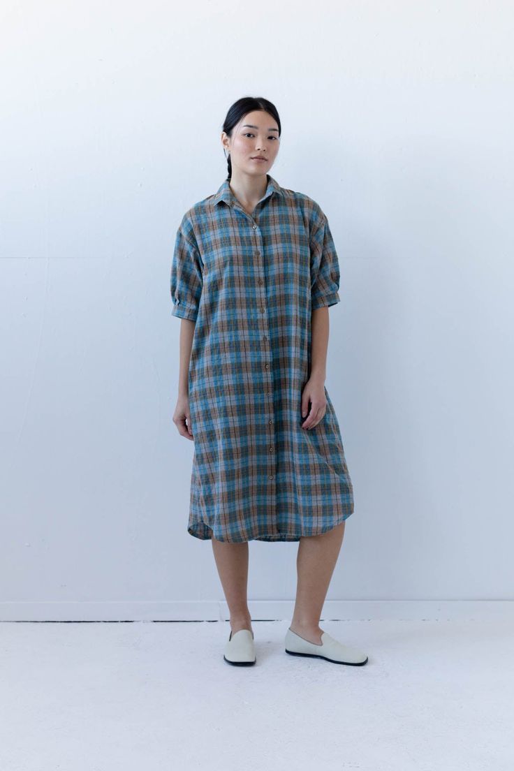 The Arden Shirt Dress is our summer go-to. This easy to wear shirt dress fits loose through the body, with gathers at the back collar and on the elbow length sleeves. In-seam pockets. Model is wearing size SMALL standard length. Model is 5'8". Please review our size guide prior to ordering. Need specific measurements? Send us an email and we will be happy to help you find the perfect fit. Relaxed Fit Shirt Dress With Shirttail Hem, Relaxed Fit Shirt Dress With Rolled Sleeves, Casual Mid-length Shirt Dress For Daywear, Oversized Collared Dress For Daywear, Relaxed Fit Short Sleeve Midi Dress For Daywear, Short Sleeve Shirt Dress For Fall Daywear, Oversized Short Sleeve Midi Dress For Daywear, Fall Shirt Dress With Rolled Sleeves For Daywear, Everyday Short Sleeve Relaxed Fit Dresses