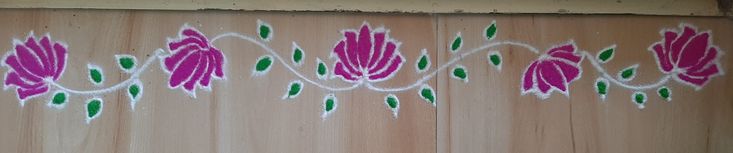 a painting on the side of a wooden wall with flowers and leaves painted on it