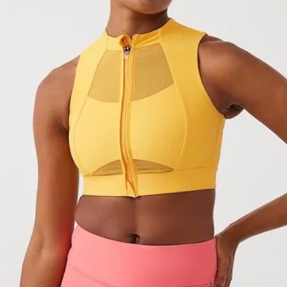 Recycled Nylon Jersey And Mesh Sport Bra. Paneled Construction Round Neck Zip Closure Elasticized Hem Logo Bonded At Side Seam Cutout At Back Hook-Eye Fastening At Back Waist Supplier Color: Mango Body: 78% Recycled Nylon, 22% Elastane. Trim: 81% Nylon, 19% Spandex. Made In Turkey. 222487f561018 Spring Nylon Sports Bra In Athleisure Style, Yellow Stretch Sleeveless Sports Bra, Yellow Stretch Sleeveless Activewear, Yellow Sleeveless Activewear For Training, Yellow Sleeveless Stretch Sports Bra, Yellow Sleeveless Sportswear Activewear, Yellow Compression Activewear For Sports, Spring Sports Bra In Nylon, Spring Sports Bra Made Of Nylon