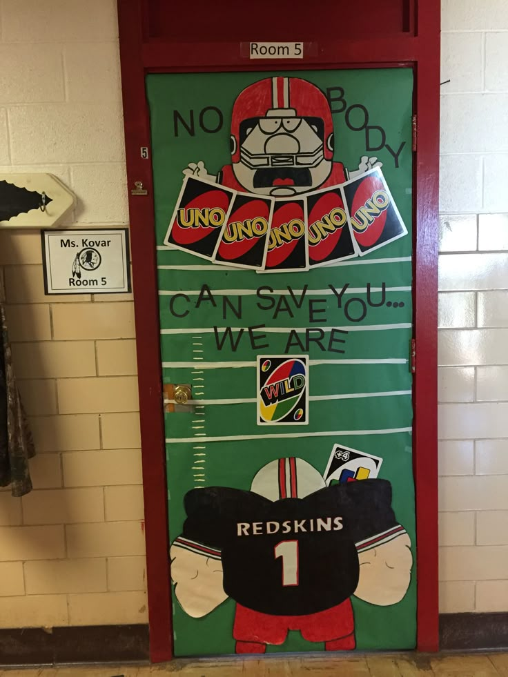 an image of a door decorated with stickers and decals for the football team