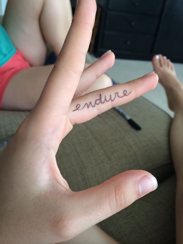 someone is holding their hand up with the word adventure written on it