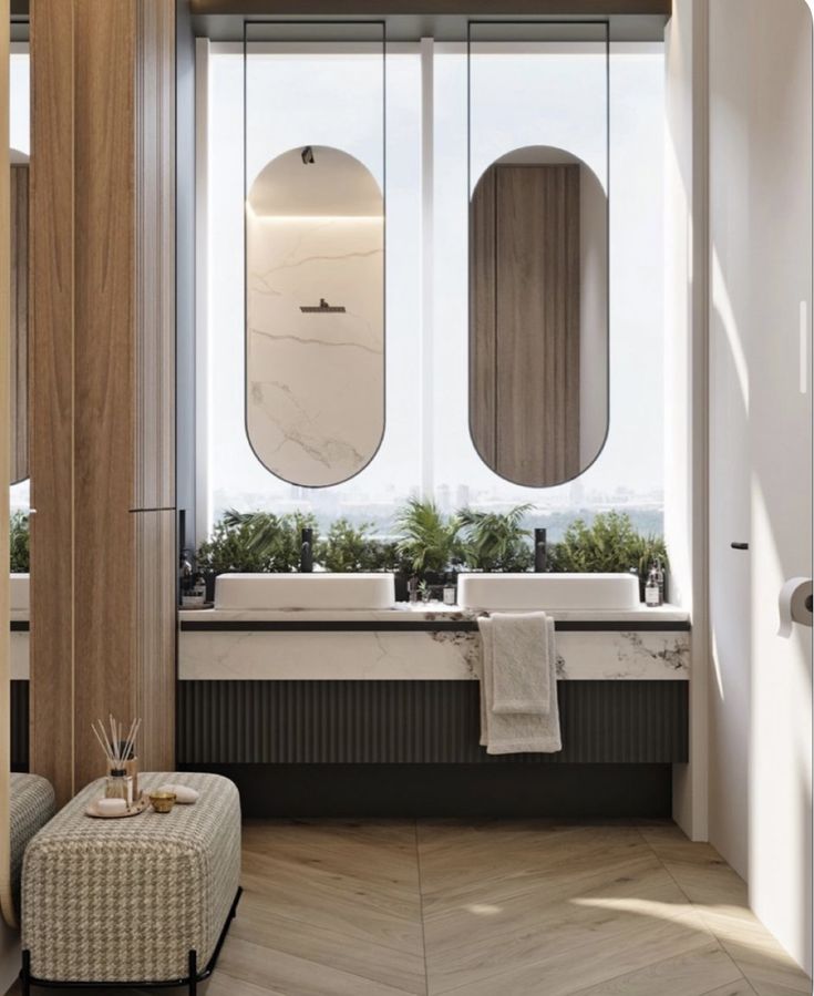 a bathroom with two sinks and mirrors in the window sill next to a bathtub