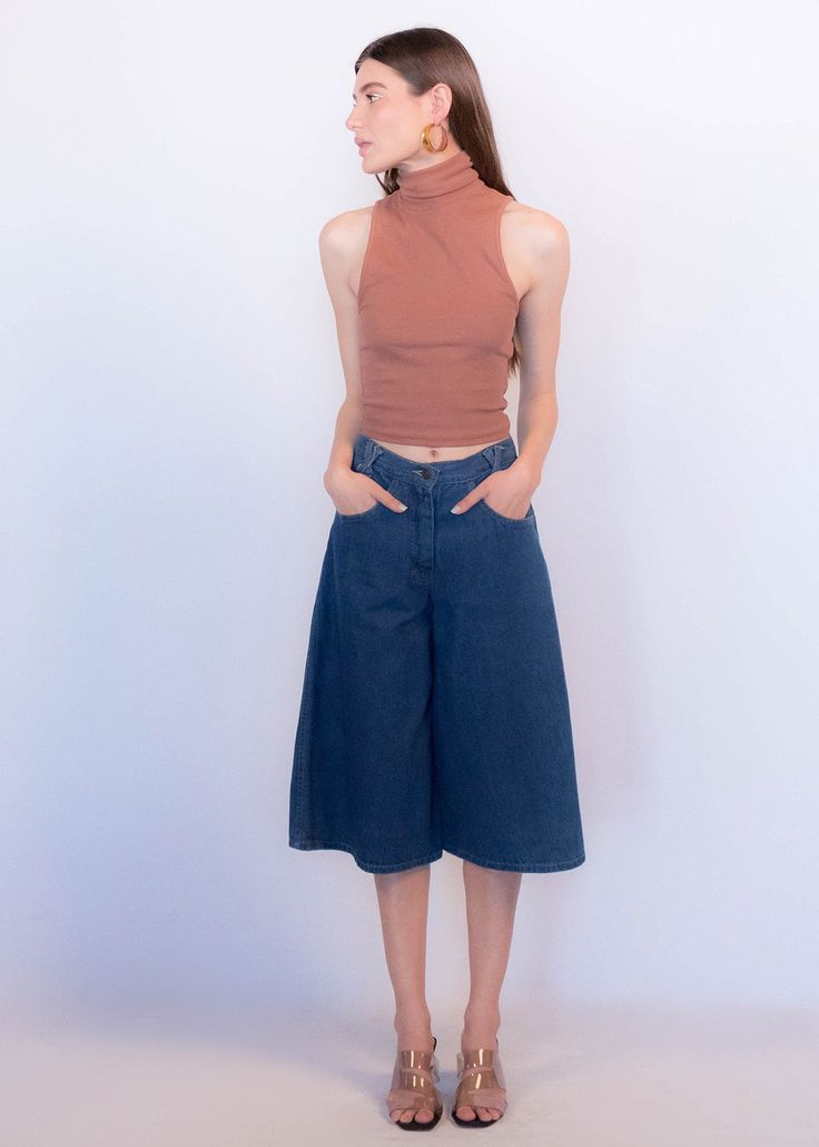 "Vintage 70s boho denim culottes. These great culottes are trending this season and are just perfect for summer style! High-waist fit. X criss-cross belt loops. Front pockets. Back western yoke detail. Wide-leg silhouette. Front button and zipper fastening. Unlined. Cut from 100% cotton. We kindly ask that you please view all measurements for comparison so you can get your desired fit. * Brand: n/a * Decade: 1970s * Fabric: 100% Cotton * Lining: Unlined * Color: Medium Dark Wash C O N D I T I O Versatile High Rise Summer Flare Jeans, Versatile High-rise Flare Jeans For Summer, Versatile Mid-rise Flare Jeans For Summer, 70s Inspired Wide Leg Jeans For Spring, Versatile High Rise Wide Leg Pants For Summer, High Waist Versatile Flare Jeans For Summer, Versatile High Waist Flare Jeans For Summer, Summer High Waist Flare Jeans, Versatile Cropped Wide Leg Summer Pants