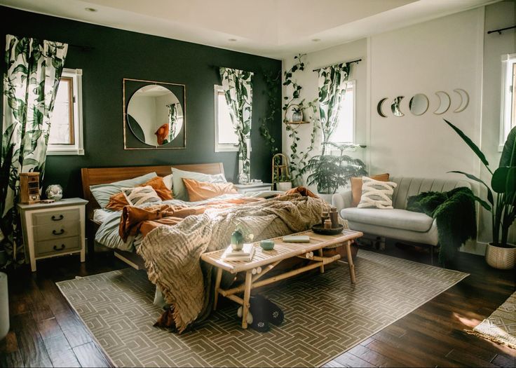 a bed room with a neatly made bed and lots of plants on the wall next to it