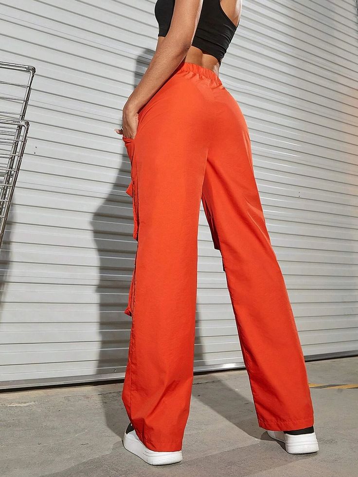 Make a bold fashion statement with these Orange Waist Flap Pocket Cargo Pants. Their plain pattern and high waistline add a touch of sophistication to your casual look. The drawstring waist ensures a comfortable fit, while the non-stretch fabric offers durability. These long-length pants are ideal for any occasion, and the waist flap pockets add a trendy twist. Details: Color: Orange Style: Casual Pattern Type: Plain Type: Cargo Pants Closure Type: Drawstring Waist Waist Line: High Waist Length: High Waist Drawstring Parachute Pants For Summer, High Waist Drawstring Pants, High Waist Pants With Side Pockets For Day Out, High-waisted Bottoms With Side Pockets For Day Out, Non-stretch High Waist Wide Leg Pants With Drawstring, Day Out High-waisted Bottoms With Side Pockets, Baggy High Waist Bottoms With Drawstring, Baggy High-waist Bottoms With Drawstring, Spring High-waisted Wide Leg Pants With Drawstring