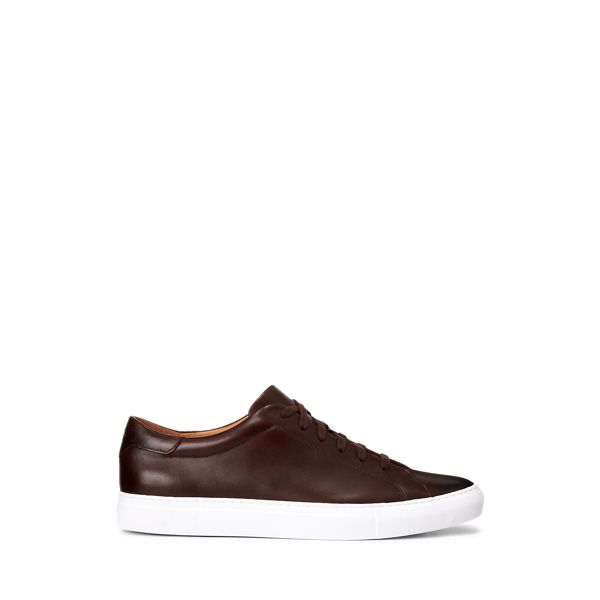 The streamlined silhouette of the Jermain sneaker is realized in pigment-dyed leather and finished with a lightweight rubber outsole. It is debossed at the tongue with Ralph Lauren’s signature Pony and at the heel with “Polo.” Classic Sneakers With Textured Sole And Wingtip Design, Classic Leather Sneakers With Vulcanized Sole, Custom Leather Slip-on Sneakers With Vulcanized Sole, Streetwear Sneakers With Leather Sole, Sporty Custom Sneakers With Vulcanized Sole, Leather High-top Sneakers With Vulcanized Sole, Leather High-top Sneakers With Plain Toe, Sporty Leather Slip-on Sneakers With Rubber Sole, Leather Low-top Slip-on Sneakers With Contrast Sole