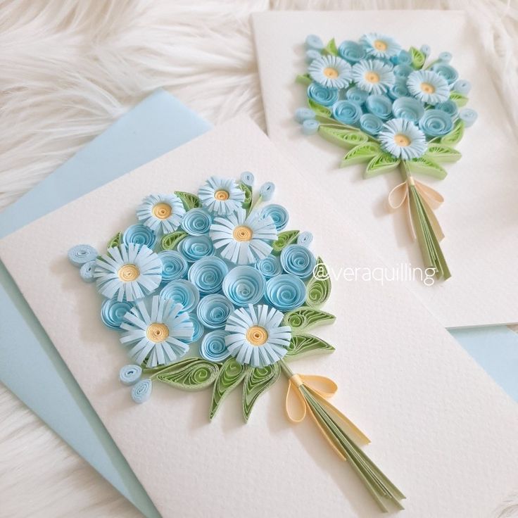 two greeting cards with blue flowers on them