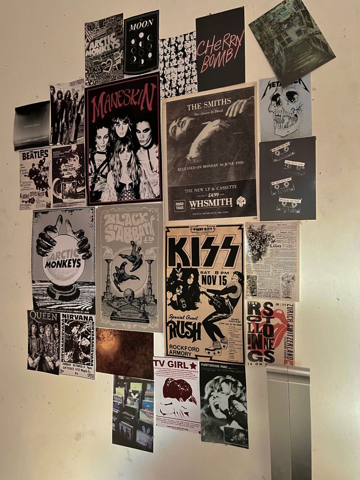 a bunch of posters are hanging on the wall