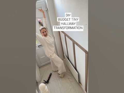 a woman in white jumps up and down the stairs with her arms raised above her head