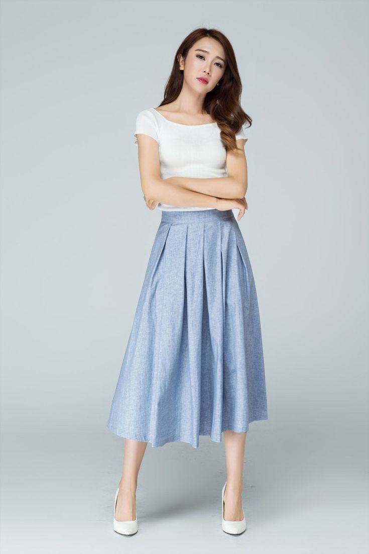 "Spring has sprung in this blue midi skirt from Xiaolizi. The linen skirt built in a high-rise, A-line silhouette with pleating throughout. The summer circle skirt topped with a banded waist + two seam pockets. DETAIL * 50% linen, 50% cotton * No lining * Seam pocket * Back zipper closure * Below Knee Length * Pleated Skirt * Perfect for summer, spring * Wash by hand or machine with cold water * The model is 163cm (5′4″) tall with a 80cm (31.5\") bust, 66cm (26\") waist. She is wearing the blue Blue Linen Skirt, Blue Midi Skirt, Work Skirt, Tailored Clothes, Skirt Pockets, Women Skirt, Skirt Summer, Work Skirts, Skirt Women