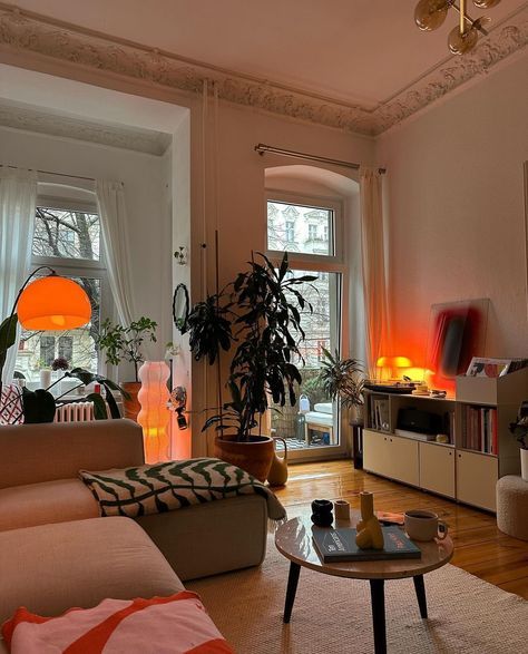 a living room filled with furniture and lots of windows