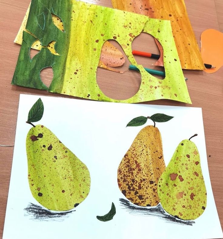 two pears are cut out to look like they have been made with colored paper