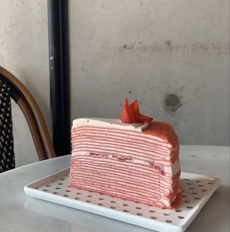 a piece of cake sitting on top of a white plate next to a wooden chair