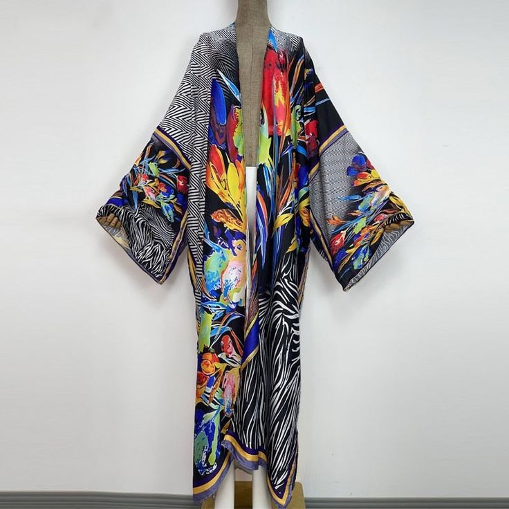 One Size fits S-3X/4X Kimono length: 58inch Material: Poly Silk (a lightweight, smooth, and shiny fabric that drapes and flows very well. An affordable alternative to silk) One Size Fits Most Size Chart Spring Party Satin Kimono, Multicolor Long One-size Kimono, Summer Multicolor Silk Kimono, Multicolor Flowy Kimono For Fall, Flowy Multicolor Kimono For Fall, Flowy Multicolor Fall Kimono, Multicolor Flowy Long Kimono, Multicolor Long Flowy Kimono, Flowy Multicolor Long Kimono