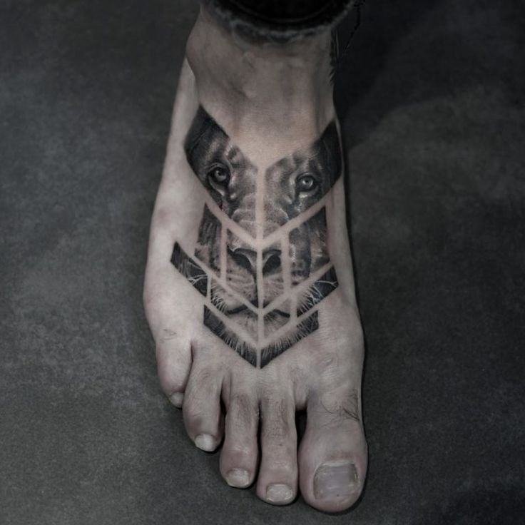 a man's foot with a geometric tattoo on it