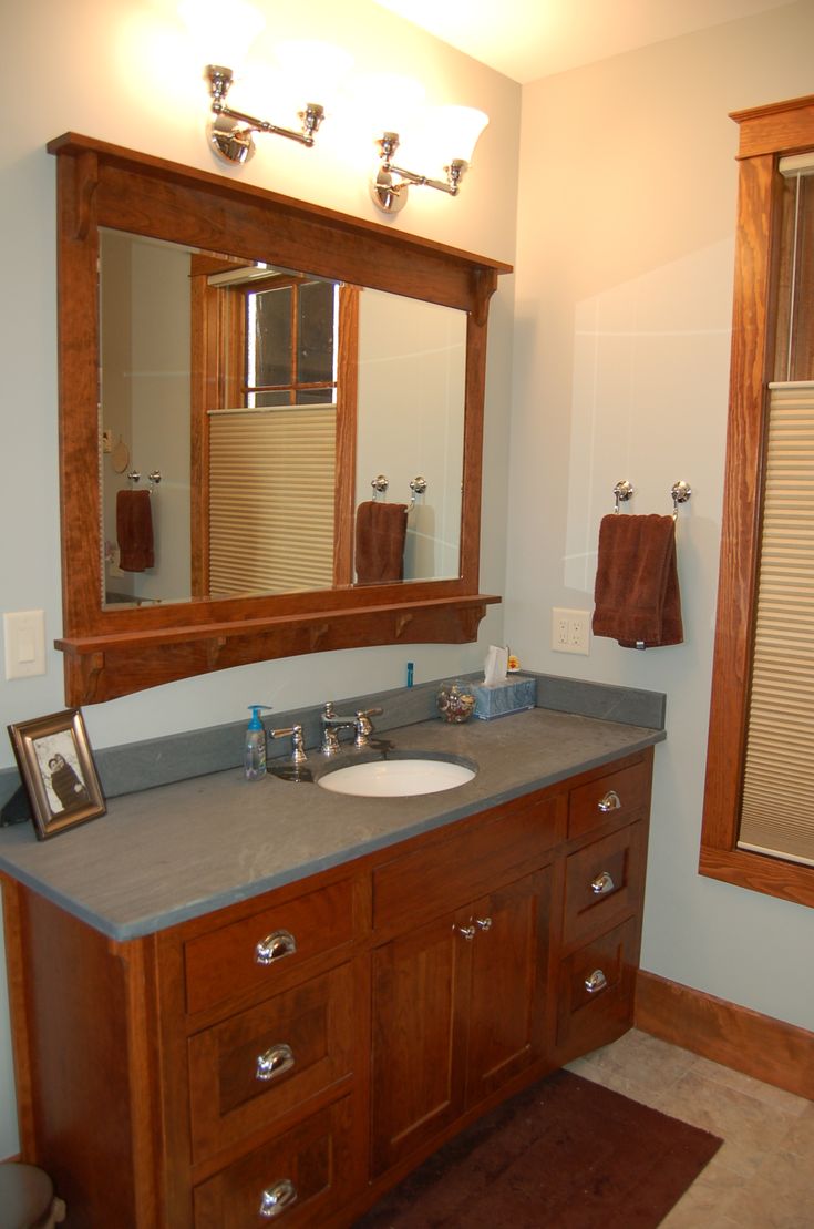 a bathroom with two sinks and mirrors in it