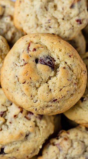 a close up view of some cookies with cranberries