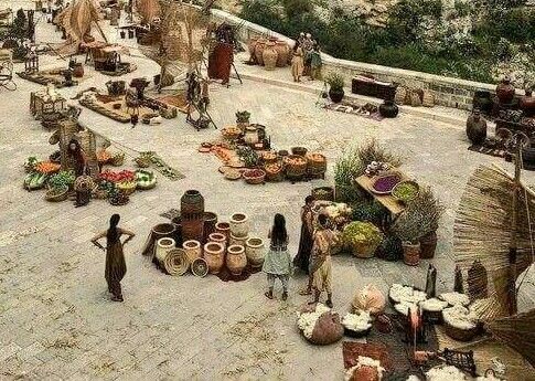 an outdoor market with lots of items on the ground